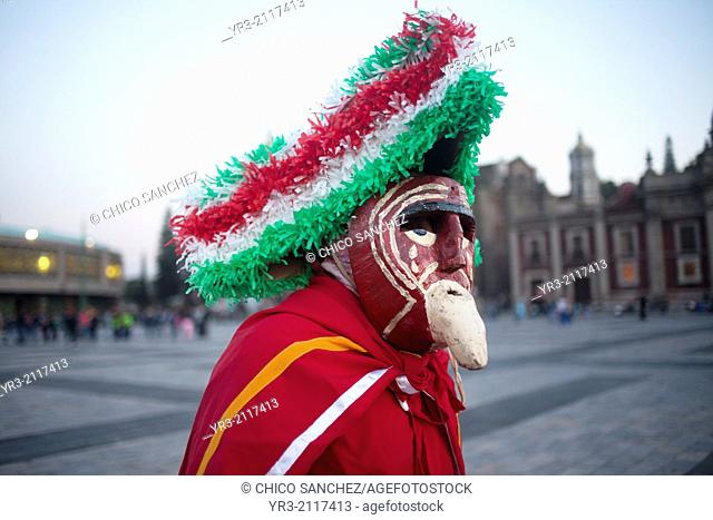 A dancer from Chocaman, Veracruz, dressed as an European, dances the Danza de los Santiagos at the pilgrimage to Our Lady of Guadalupe Basilica in Mexico City