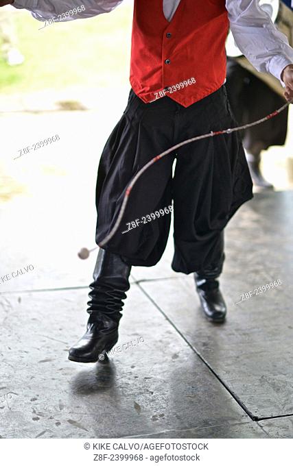 Uruguayan Traditional Dancer using the "" boleadoras"", originally a hunting tool used by the Gauchos along the River Plata