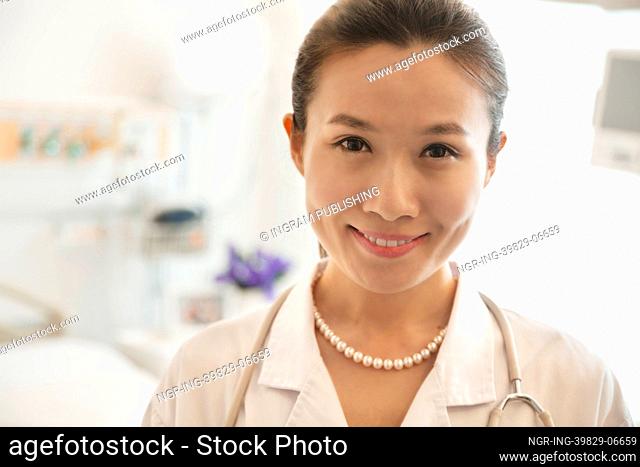 Portrait of smiling young female doctor in a hospital
