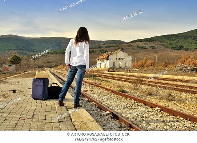 Woman in railway station. Buitrago de Lozoya, Madrid province, Spain