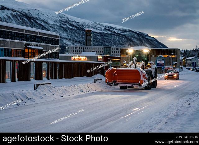 Tromso, Norway - December 2018 : Powerful snowplough clearing residential roads in Tromso town in winter