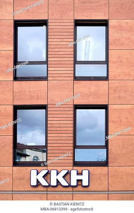 The facade of the modern office building of the Kaufmännische Krankenkasse KKH with logo and office windows in Mainz