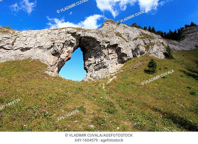 The rock arch 'Okno' at the natural reserve Ohniste, Janska dolina in Nizke Tatry mountains, Slovakia