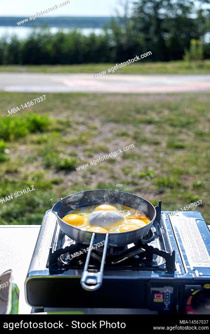 Gas stove, pan, fried eggs, camping vacation