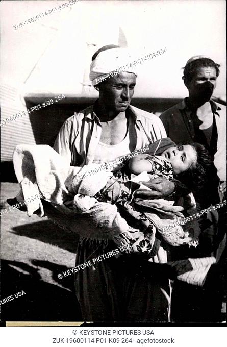 1966 - Scenes Of The Earthquake In Algeria carries his little daughter to one of the field hospitals. She has both legs crushed