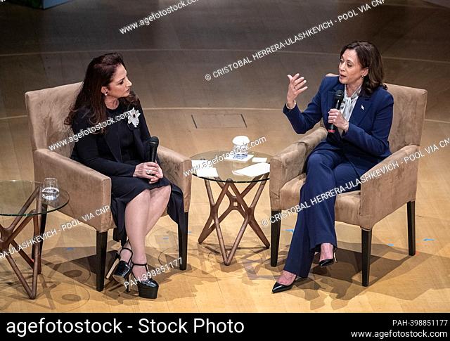 The United States Vice President Kamala Harris (R) participates, next to songwriter Gloria Estefan, in a moderated conversation focused on 'the Biden-Harris...