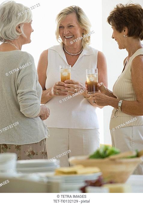 Senior women socializing at luncheon