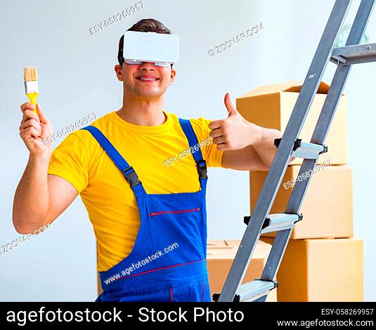 The painter contractor working with virtual reality goggles