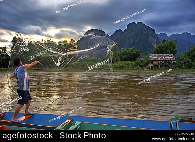 Fisher in Nam Song river next to Vang Vieng village, Laos