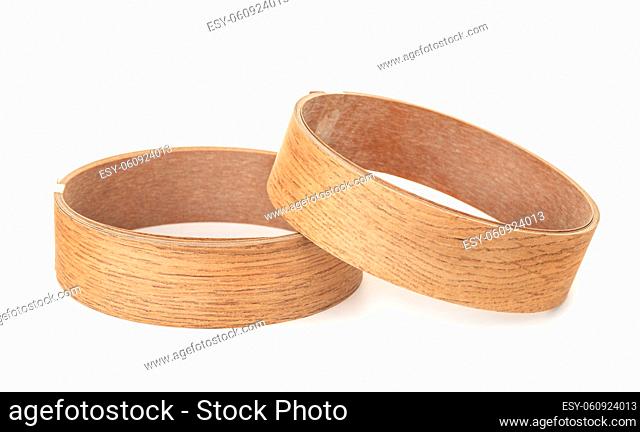 Two rolls of decorative wood molding trims isolated on white