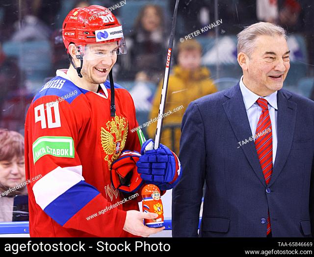 RUSSIA, ST PETERSBURG - DECEMBER 17, 2023: Russia 25's Valentin Zykov (L) and Russian Ice Hockey Federation President Vladislav Tretiak are seen winning their...