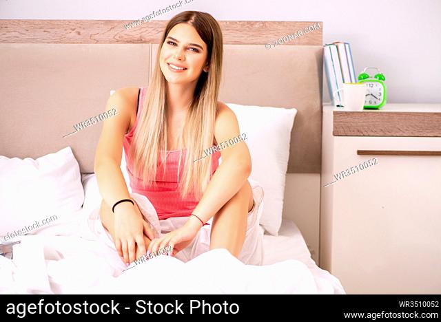 Young woman waking in the morning