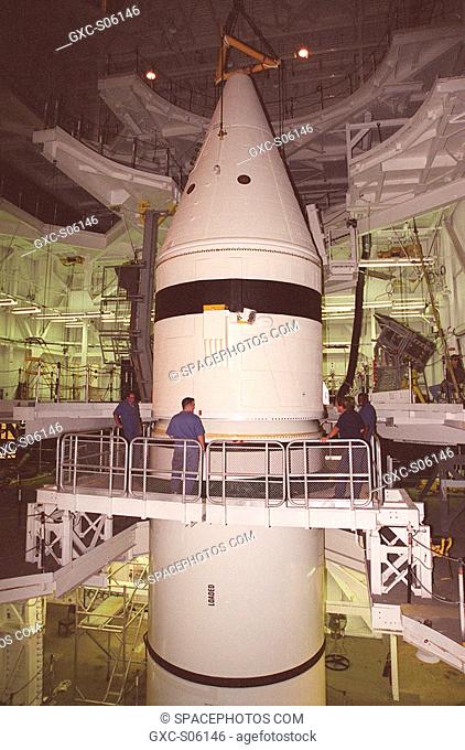06/29/2000 --- Inside the Vehicle Assembly Building, the forward section of a solid rocket booster SRB sits on top of the rest of the stack for mating