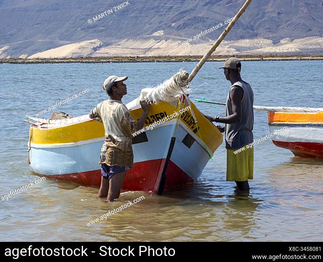 Fishermen getting ready to go fishing with traditional fishing boats near Baia das Gatas. Island Sao Vicente, Cape Verde an archipelago in the equatorial
