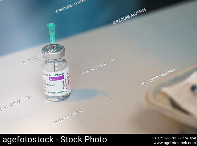 25 February 2021, Rhineland-Palatinate, Mainz: An empty vial of Corona vaccine from AstraZeneca stands on the table after being drawn up