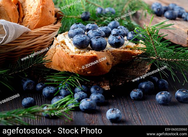 Desserts with fresh blueberries on wooden table