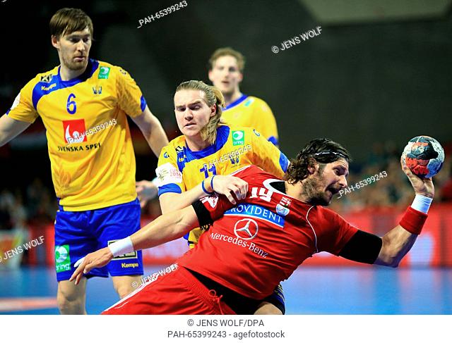 Hungary's Laszlo Nagy (R) in action against Sweden's Lukas Nilsson during during the 2016 Men's European Championship handball group 2 match between Sweden and...