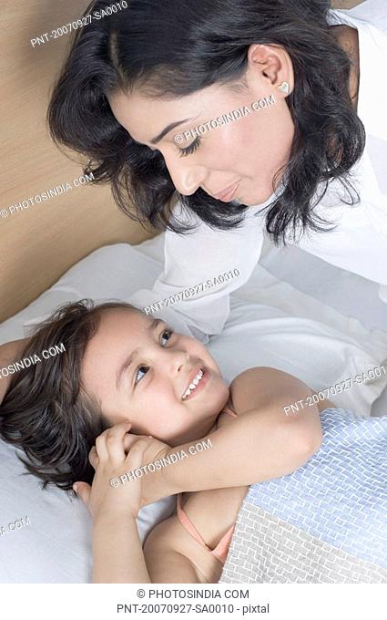 High angle view of a young woman smiling with her daughter