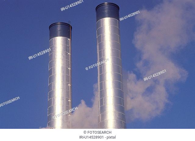 Two smokestacks in industrial America
