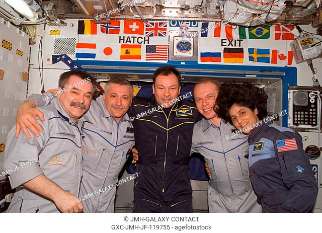 The crewmembers onboard the International Space Station pose for a group portrait during the ceremony of Changing-of-Command from Expedition 14 to Expedition 15...