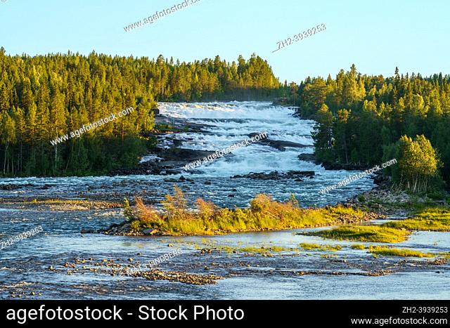 Storforsen waterfall in the evening at summer time with clear blue sky, Älvsbyn county, Norrbotten province, Sweden