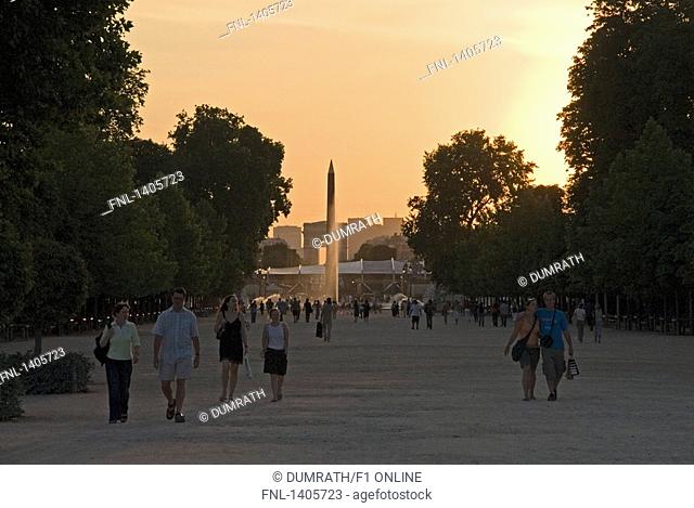Tourists in front of obelisk column