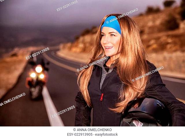 Nice young biker on the road