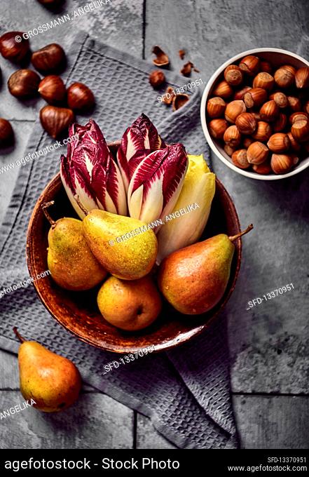 Treviso, chicory and pears in a bowl with chestnuts and nuts