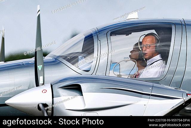 08 July 2022, Schleswig-Holstein, Tinnum/Sylt: CDU leader Friedrich Merz and his wife Charlotte arrived in Sylt on their private plane for the wedding of German...