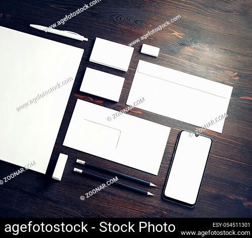 Blank corporate stationery set on wood table background. Branding mock up. Template for placing your design