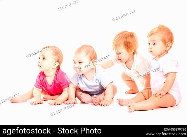 Childhood concept. Cute 6-9 old moths babies isolated on white background