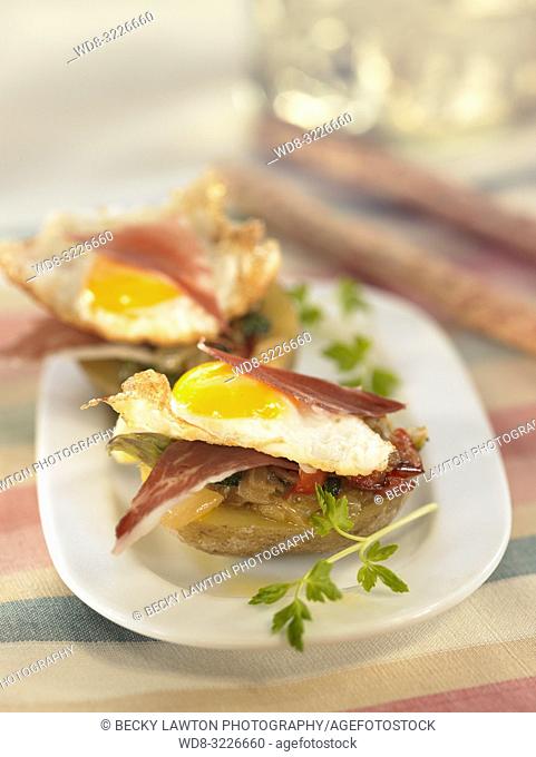 platillo de patatas rellenas de pisto, jamon serrano y huevos de cordoniz / potatoes stuffed with ratatouille, serrano ham and quail eggs