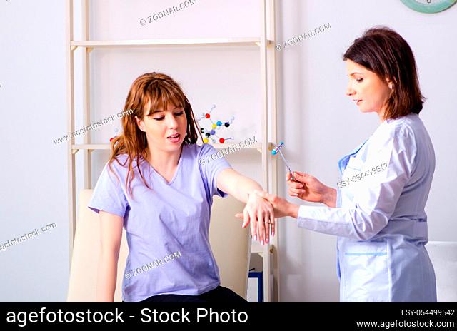 The young woman visiting female doctor physiotherapist