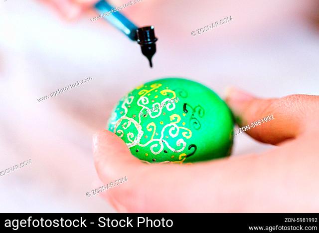 Hand painted Ukrainian Easter eggs decorated with folk designs using a wax resist method