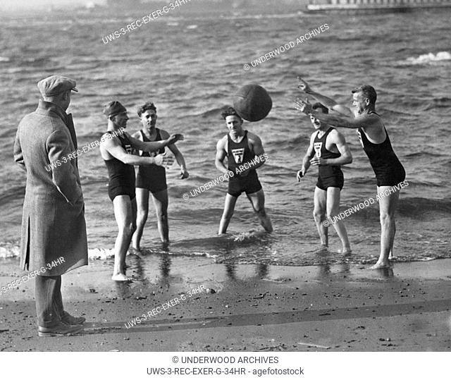 New York, New York: December 4, 1926.Members of the College Point Penguin Club in Queens meet every mornig of the year to swim and toss the medicine ball in the...