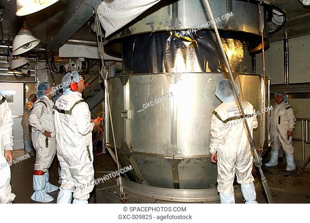 06/19/2002 -- On the launch tower at Launch Complex 17-A, Cape Canaveral Air Force Station, technicians watch as the container that enclosed the Comet Nucleus...