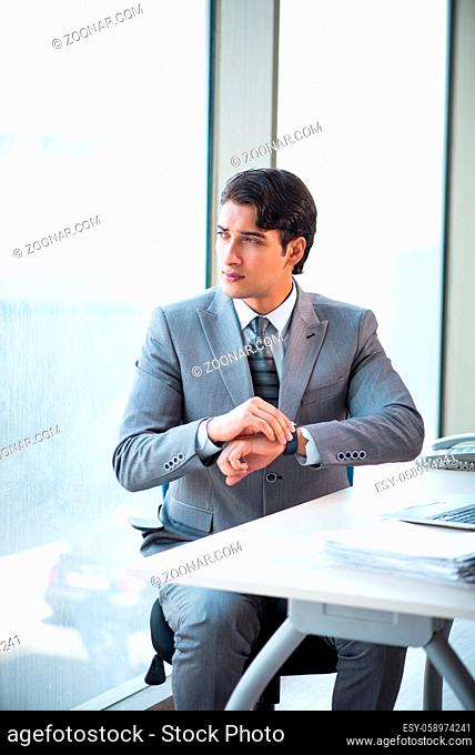 Young successful businessman working at the office