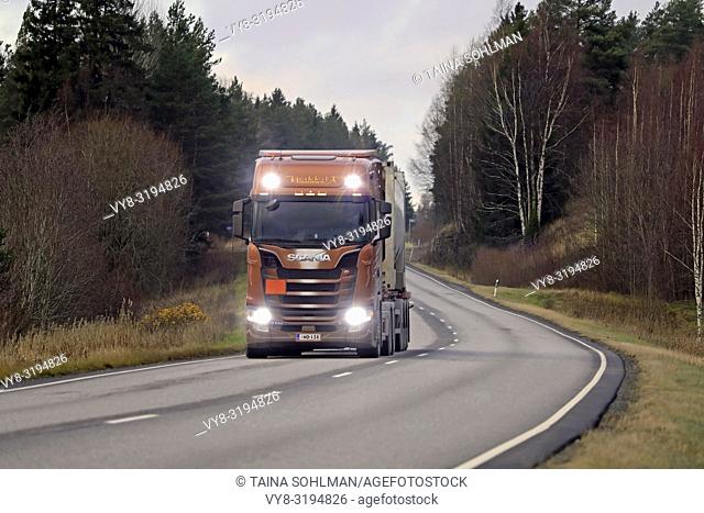 Salo, Finland - November 16, 2018: Next Generation Scania S730 of Heikkila for chemical transport on the road in autumn with high beams on briefly.