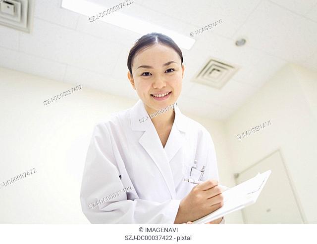 A smiling medical technologist