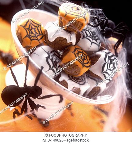Halloween muffins with cobweb icing in a bowl