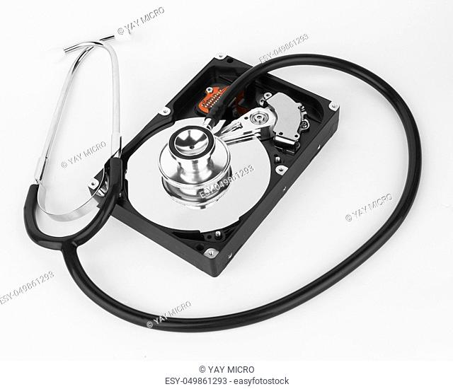Computer hard drive and a stethoscope, on white background