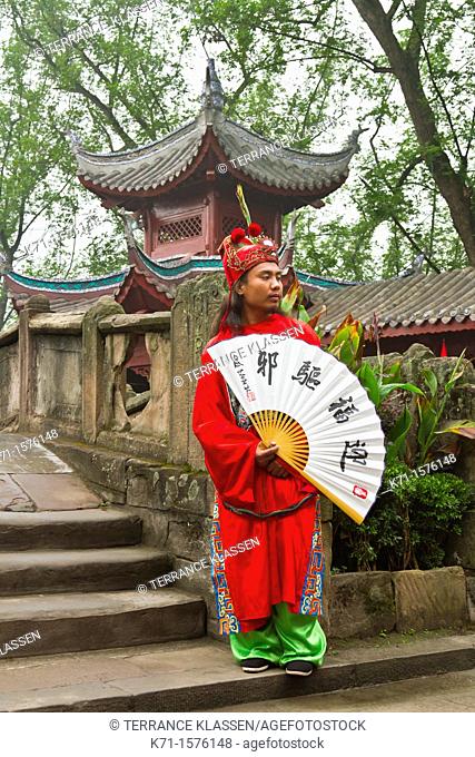 A dynasty warrior in ethnic dress welcomes guests to the city of Ghosts in Fengdu, China, Asia