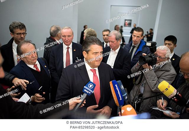 The German Minister for Economic Affairs Sigmar Gabriel (SPD) talks to journalists before attending an exhibition of the works of the Chinese artist Zeng Fanzhi...