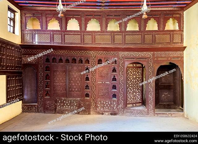 Oriental wooden engraved arabesque decorations with balcony installed inside empty spacious room