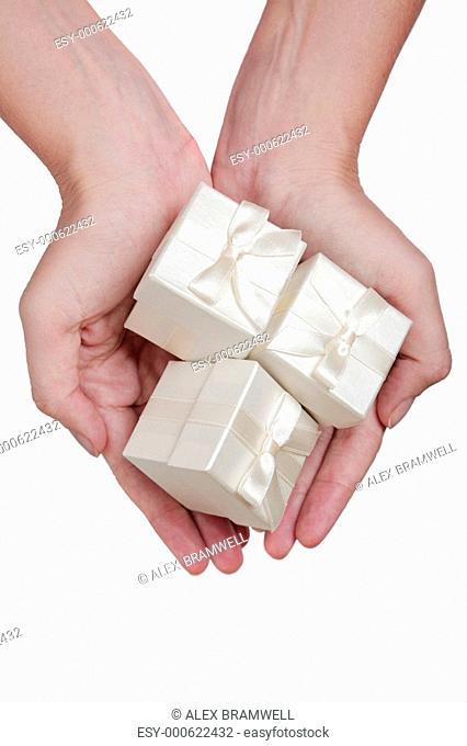 Hands and White Gifts
