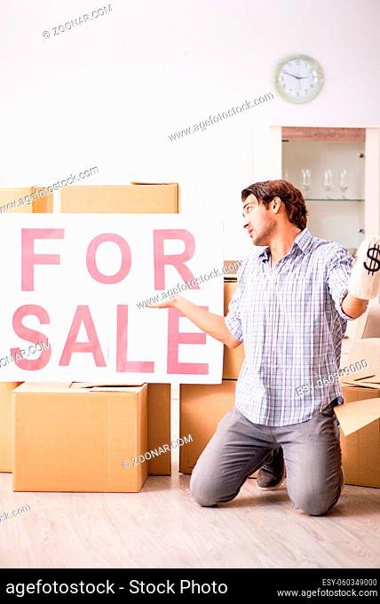 Young man offering home for sale and moving out