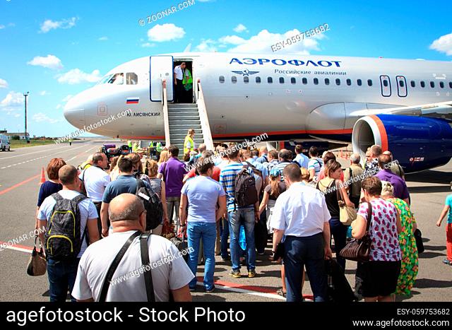 Volgograd, Russian Federation, August 07, 2015: People boarding in the airplaine