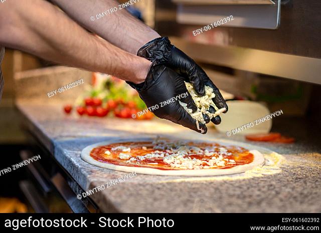 Pizza. Chef baking pizza in the italian pizzeria