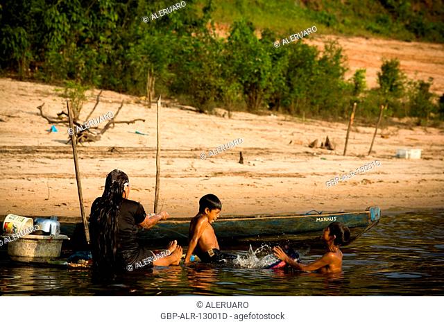 People Taking A shower in the River, Terra Preta Community, Cuieiras River, Amazônia, Manaus, Amazonas, Brazil