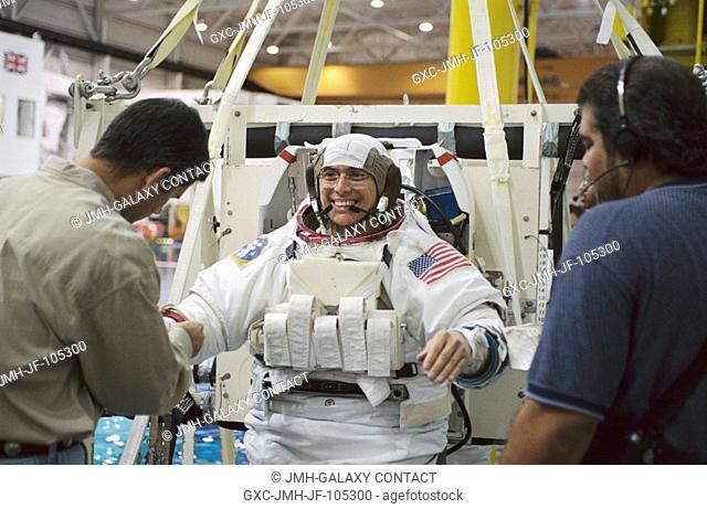 Astronaut Franklin R. Chang-Diaz, STS-111 mission specialist, is photographed as the final touches are made on the training version of the Extravehicular...